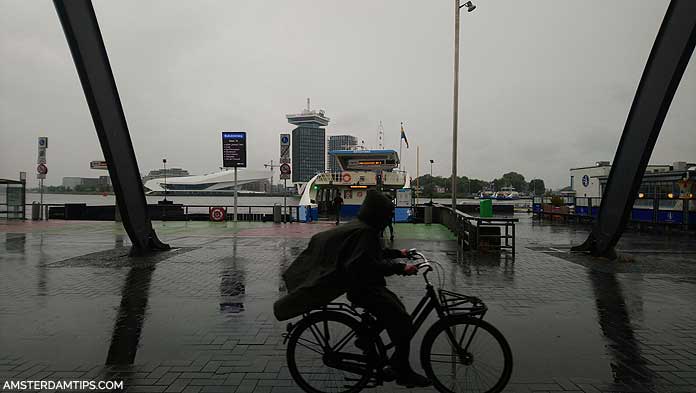 amsterdam central ferries in the rain